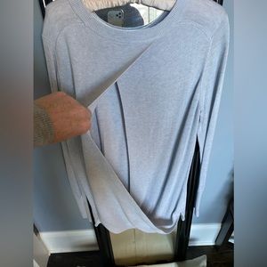 Lululemon grey open back sweater with openings for hand warming. size M. no tags